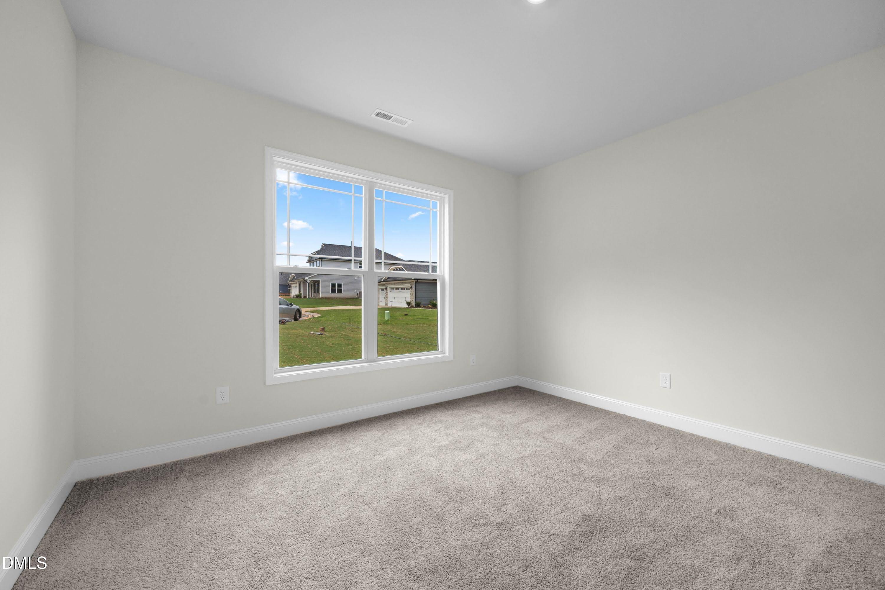 227 Galway Road Lillington, NC 27546 - Photo 26 of 36 a view of an empty room with a window