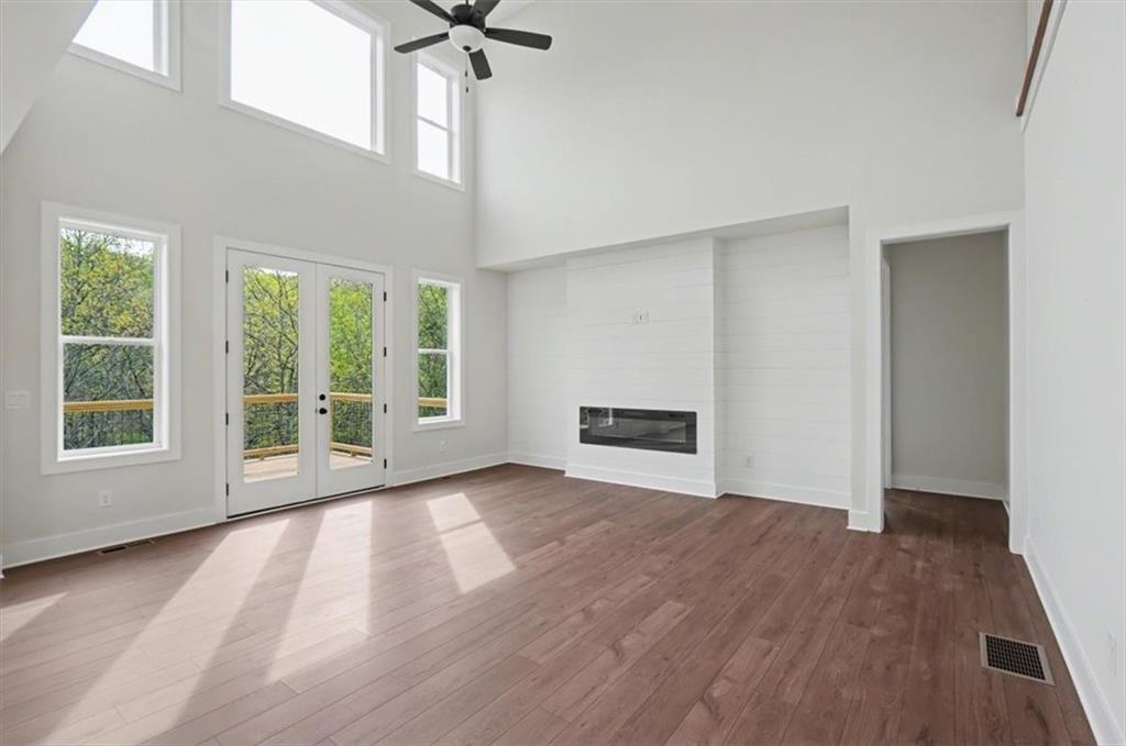 16 Altar Rock Court Cartersville, GA 30121 - Photo 20 of 52 a view of an empty room with a window and wooden floor