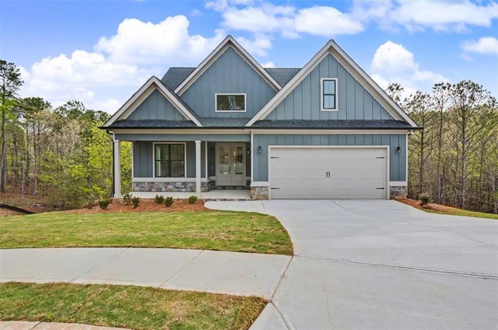 16 Altar Rock Court Cartersville, GA 30121 - Photo 2 of 52 a front view of a house with a yard and garage