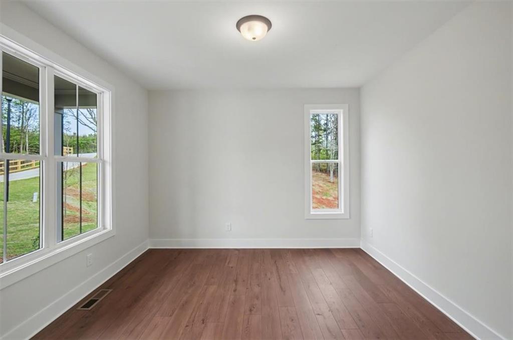 16 Altar Rock Court Cartersville, GA 30121 - Photo 25 of 52 a view of an empty room with wooden floor and a window