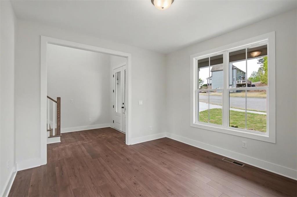 16 Altar Rock Court Cartersville, GA 30121 - Photo 26 of 52 an empty room with wooden floor and windows
