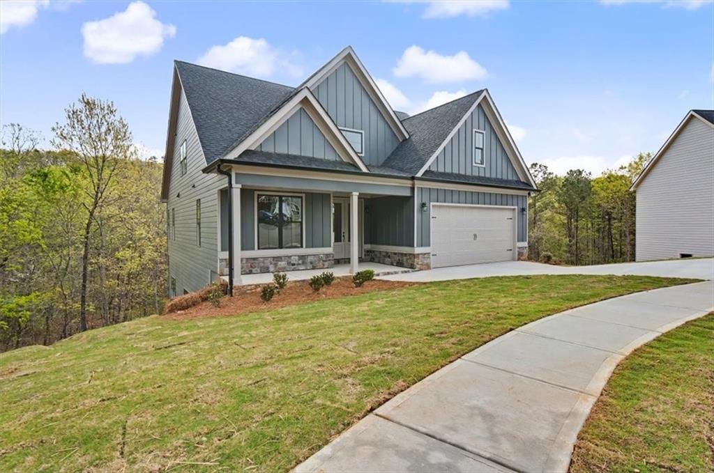 16 Altar Rock Court Cartersville, GA 30121 - Photo 3 of 52 a front view of a house with garden