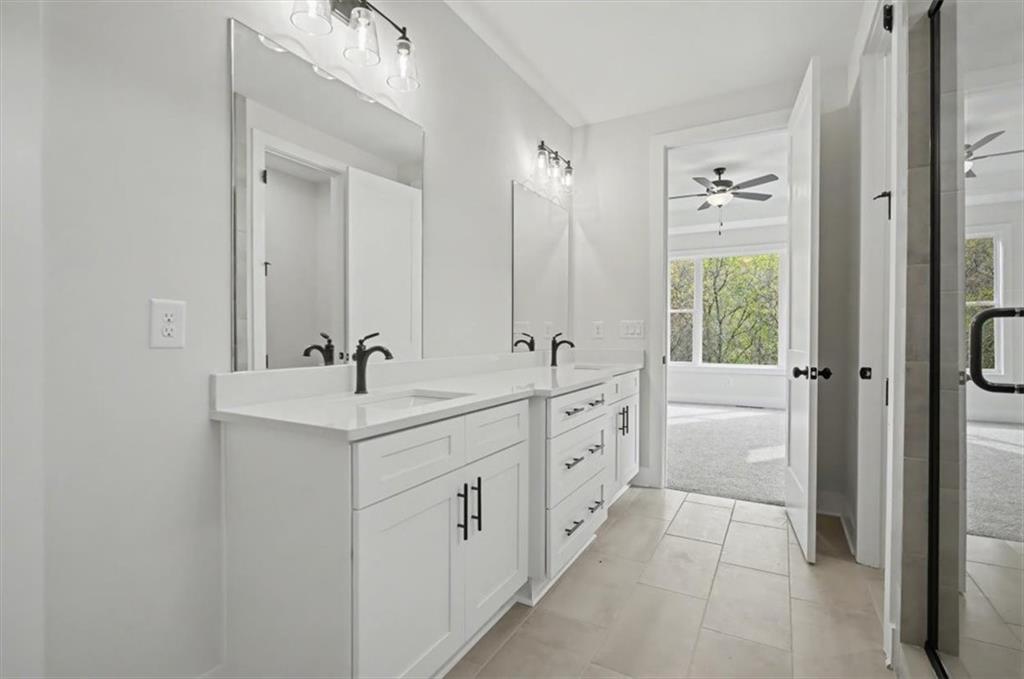 16 Altar Rock Court Cartersville, GA 30121 - Photo 34 of 52 a spacious bathroom with double sink and mirror