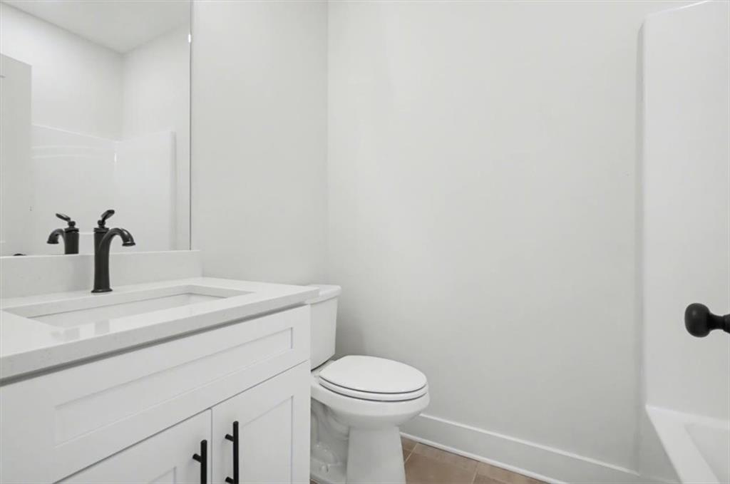 16 Altar Rock Court Cartersville, GA 30121 - Photo 37 of 52 a bathroom with a sink a toilet and mirror