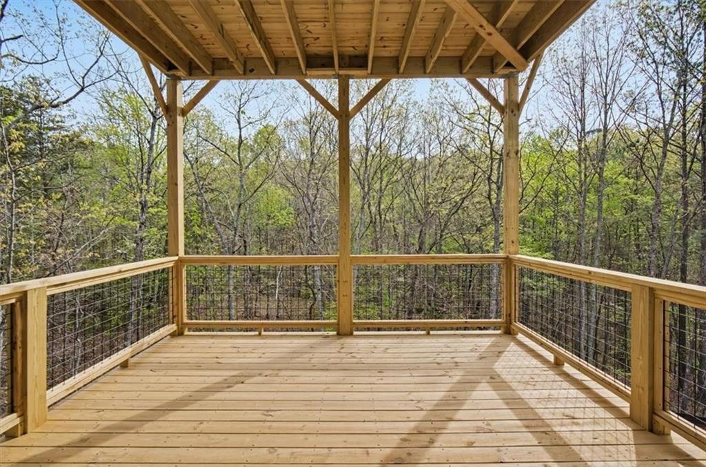 16 Altar Rock Court Cartersville, GA 30121 - Photo 48 of 52 a view of a balcony with wooden floor and fence