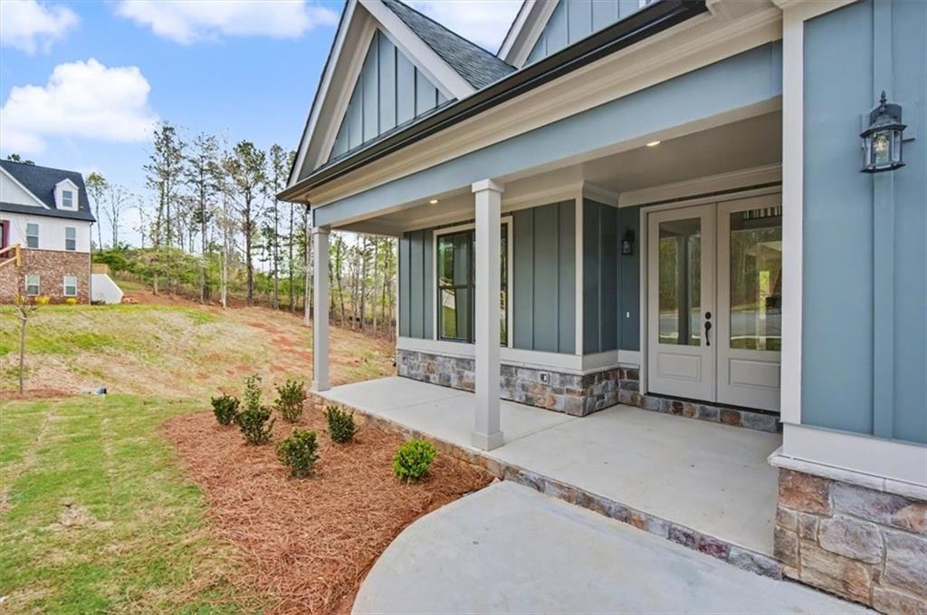 16 Altar Rock Court Cartersville, GA 30121 - Photo 5 of 52 a front view of a house with a outdoor seating
