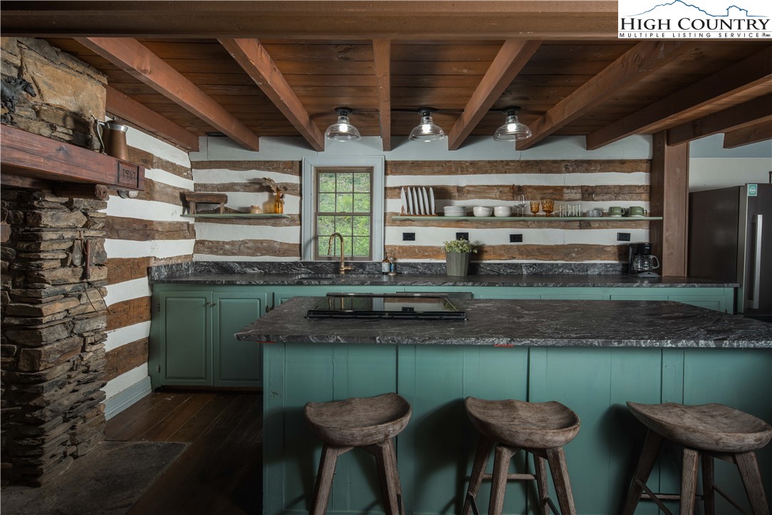1534 Highway 194 Boone, NC 28607 - Photo 11 of 50 a kitchen with counter top space cabinets and stainless steel appliances