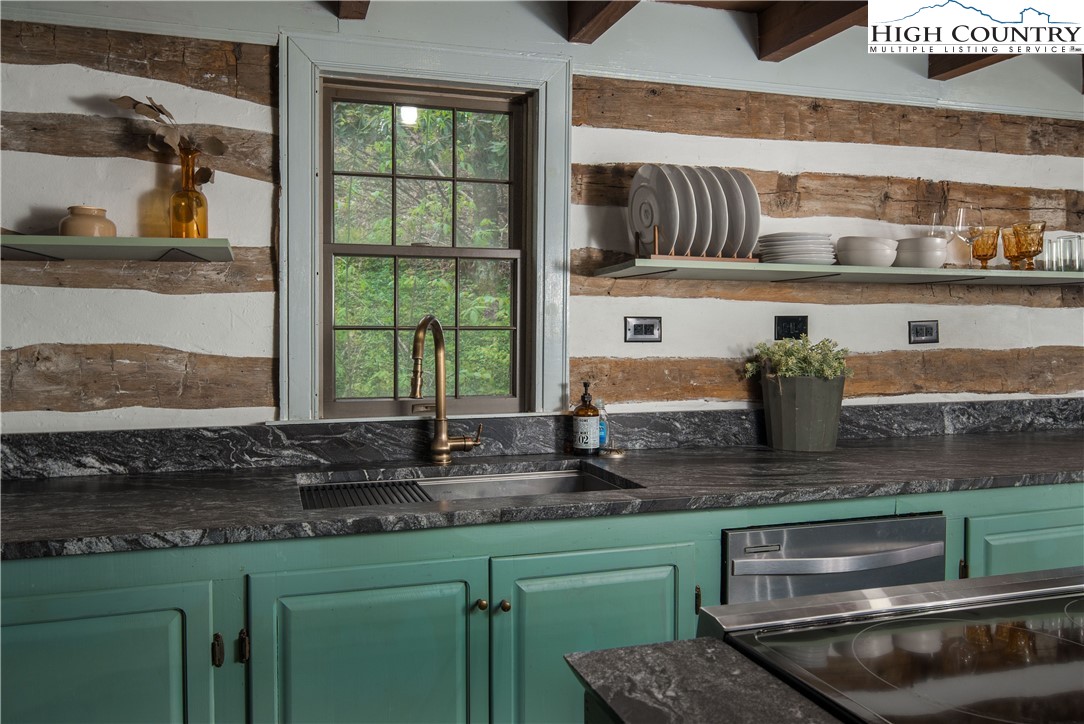 1534 Highway 194 Boone, NC 28607 - Photo 13 of 50 a kitchen with stainless steel appliances granite countertop a sink and a stove