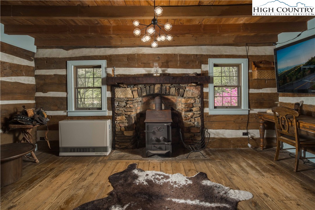 1534 Highway 194 Boone, NC 28607 - Photo 22 of 50 a living room with furniture and a fireplace