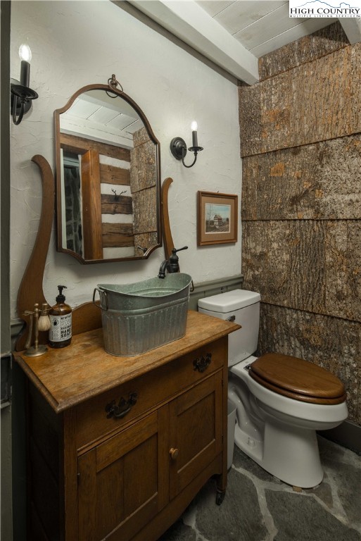 1534 Highway 194 Boone, NC 28607 - Photo 24 of 50 a bathroom with a toilet sink and mirror