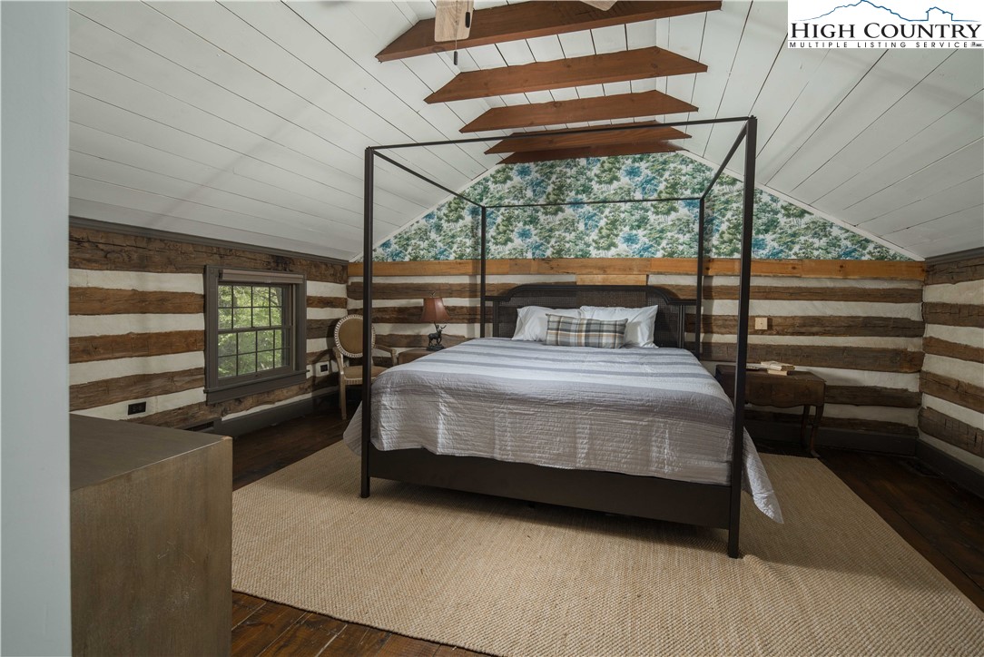 1534 Highway 194 Boone, NC 28607 - Photo 30 of 50 a bedroom with a bed and wooden floor
