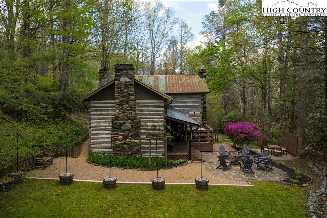 1534 Highway 194 Boone, NC 28607 - Photo 37 of 50 a view of house with backyard and garden
