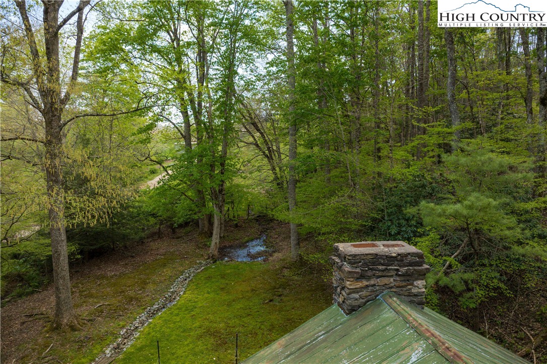 1534 Highway 194 Boone, NC 28607 - Photo 38 of 50 a wooden bench sitting in the middle of a yard