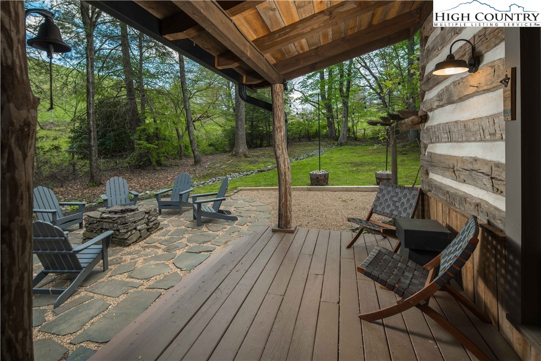 1534 Highway 194 Boone, NC 28607 - Photo 49 of 50 a view of a patio with table and chairs and wooden floor