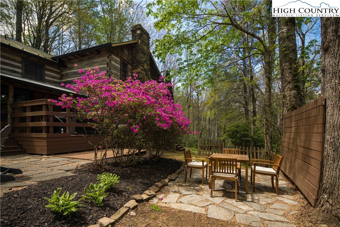 1534 Highway 194 Boone, NC 28607 - Photo 6 of 50 a backyard of a house with table and chairs and potted plants