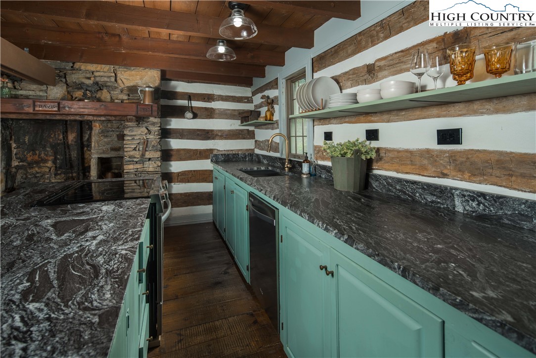 1534 Highway 194 Boone, NC 28607 - Photo 10 of 50 a kitchen with stainless steel appliances granite countertop a sink and cabinets