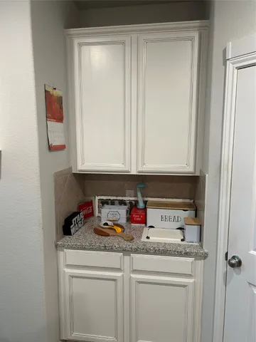 a kitchen with a sink and a stove top oven