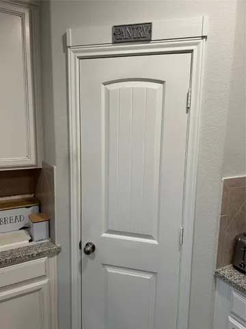 a bedroom with a bed chair and window