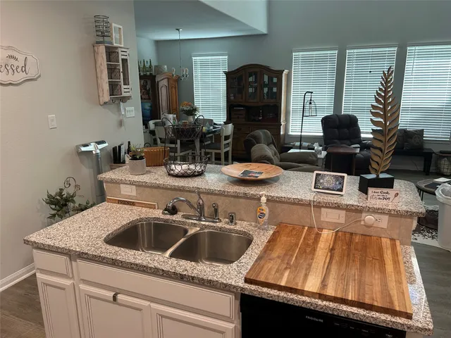 a view of a room with furniture and a window