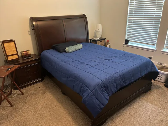 a view of a livingroom with furniture and a window
