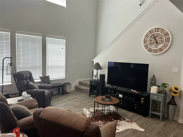 a living room with furniture and a rug