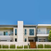 a view of house with a yard