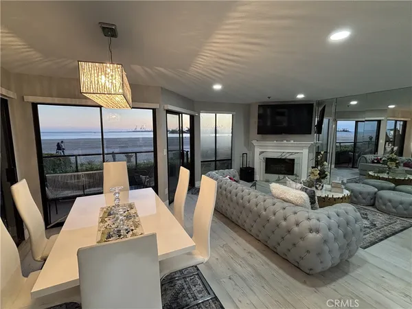 a living room with furniture fireplace and a flat screen tv