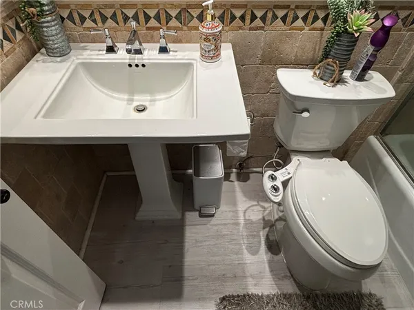 a bathroom with a sink and toilet