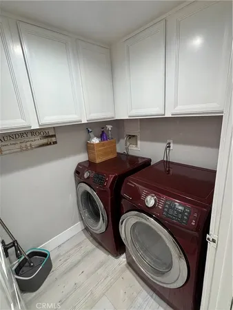 a utility room with sink dryer and washer