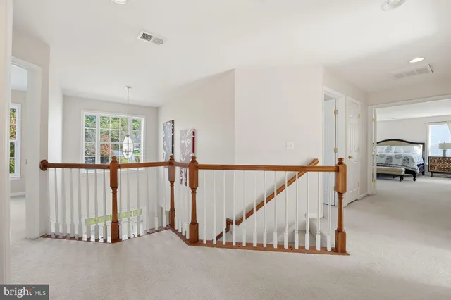 a white bath tub sitting next to a window