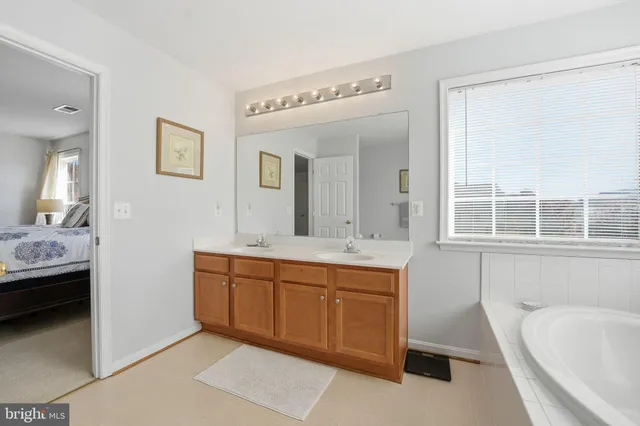 a bedroom with a bed and a table