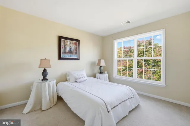 an empty room with furniture and window
