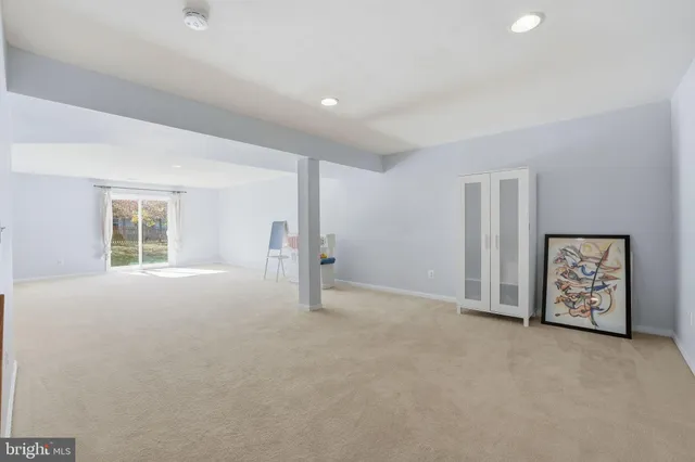 a bedroom with bed and a chandelier