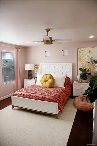 a bedroom with a bed and window