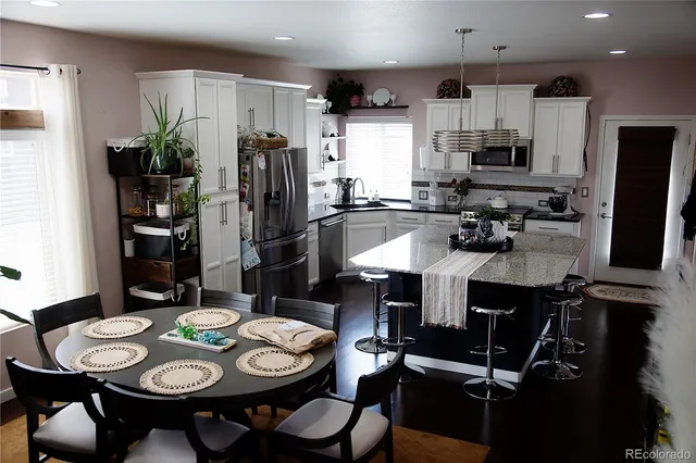 a view of a dining room with furniture