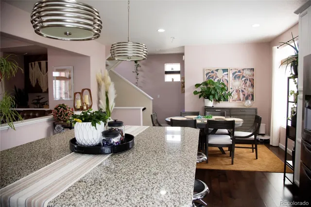 a living room with furniture ceiling fan and a window