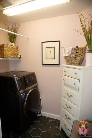 a outdoor sitting area with furniture and wooden floor