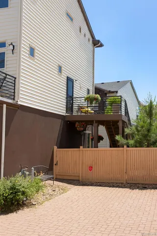 a view of a house with a wooden fence