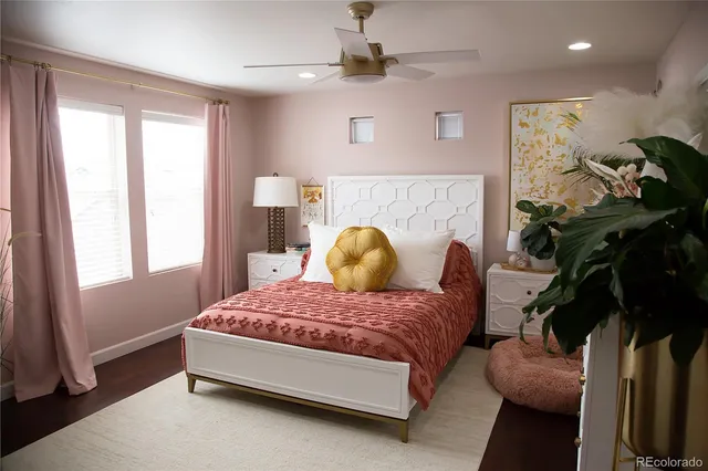 a bedroom with a bed and window