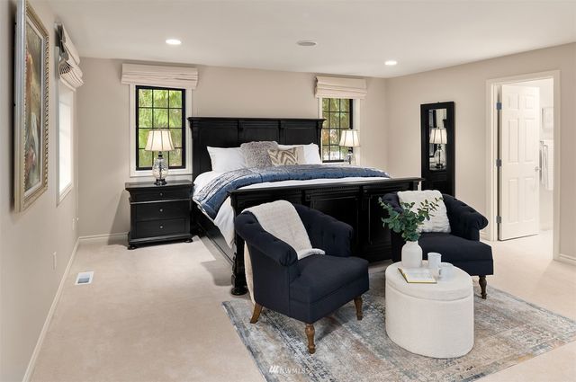 a bathroom with a sink double vanity and a mirror