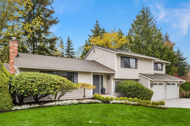 a roof deck with a table and chairs