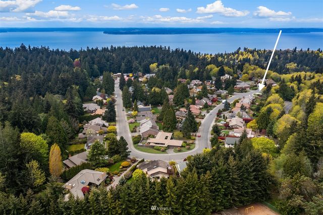 a view of a swimming pool with a yard