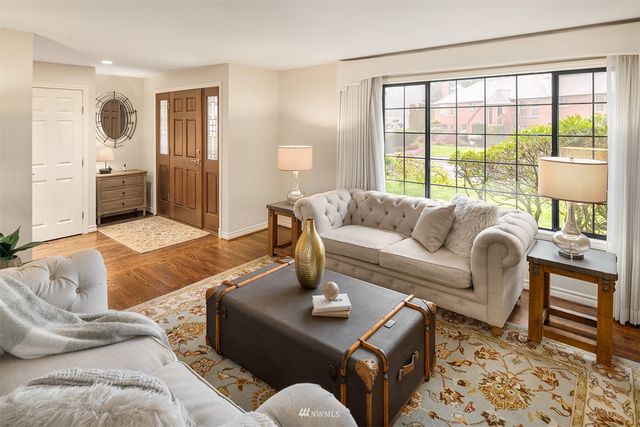 a living room with furniture and a table