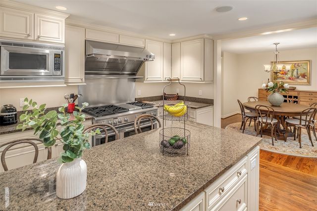 a kitchen with a table and chairs in it
