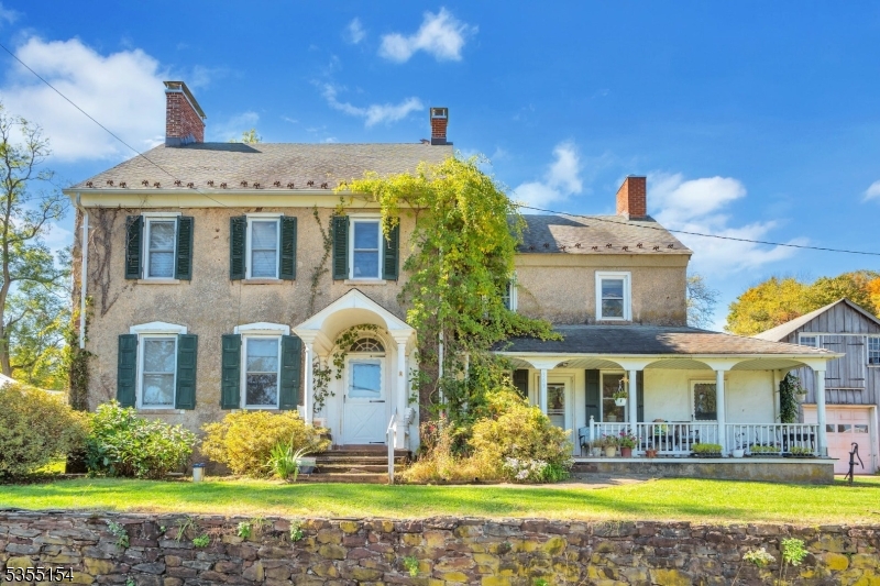 369 Stamets Road Milford, NJ 08848 - Photo 12 of 12 a front view of a house with garden