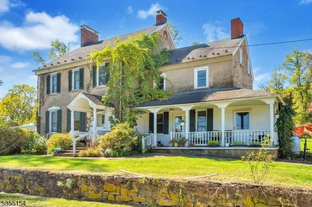 a front view of house with yard swimming pool and outdoor seating
