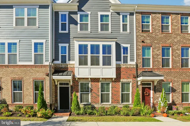 a front view of a brick building with many windows