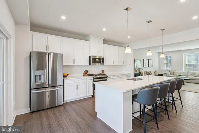 a kitchen with stove and cabinets
