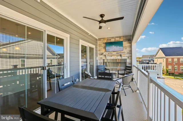 a spacious bedroom with a large bed and a chandelier