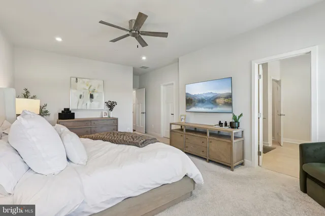 a bathroom with double vanity sinks and a mirror